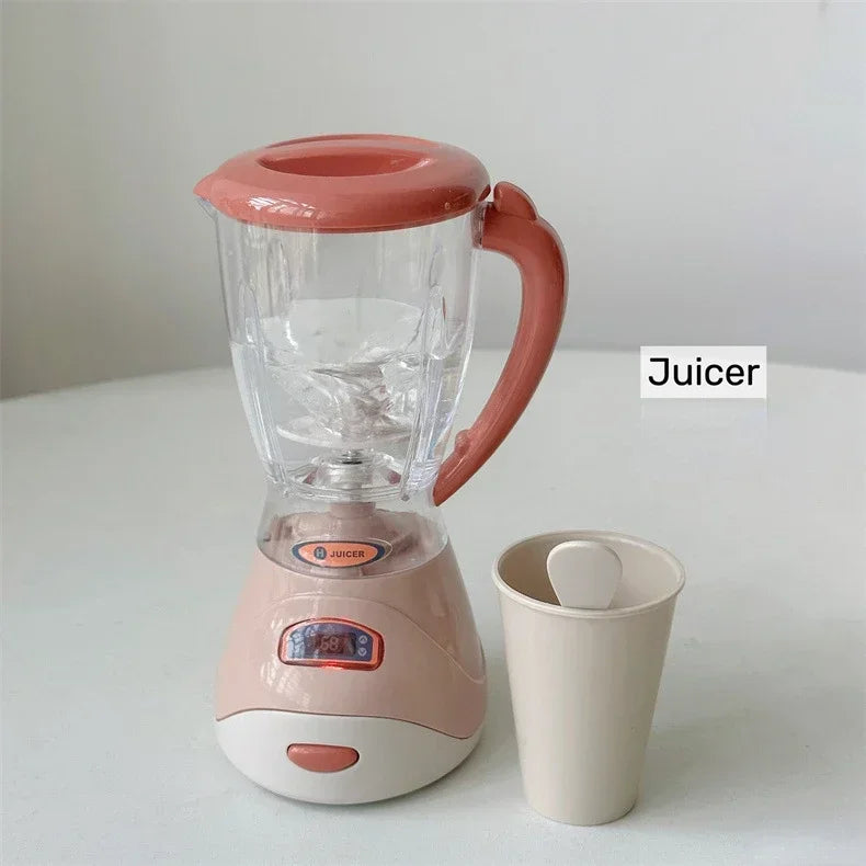 A pink and clear juicer appliance with a handle sits on a white surface.