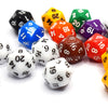A collection of colorful D20 dice, including black, blue, yellow, green, purple, and red, scattered on a white surface.