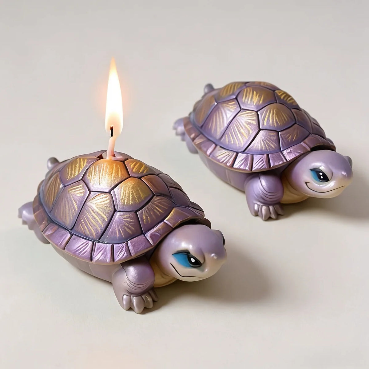 A small purple silicone mold shaped like a turtle with a lit candle on its back.
