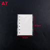 White silicone mold for an A7 notebook cover with punched holes, shown against a black background.