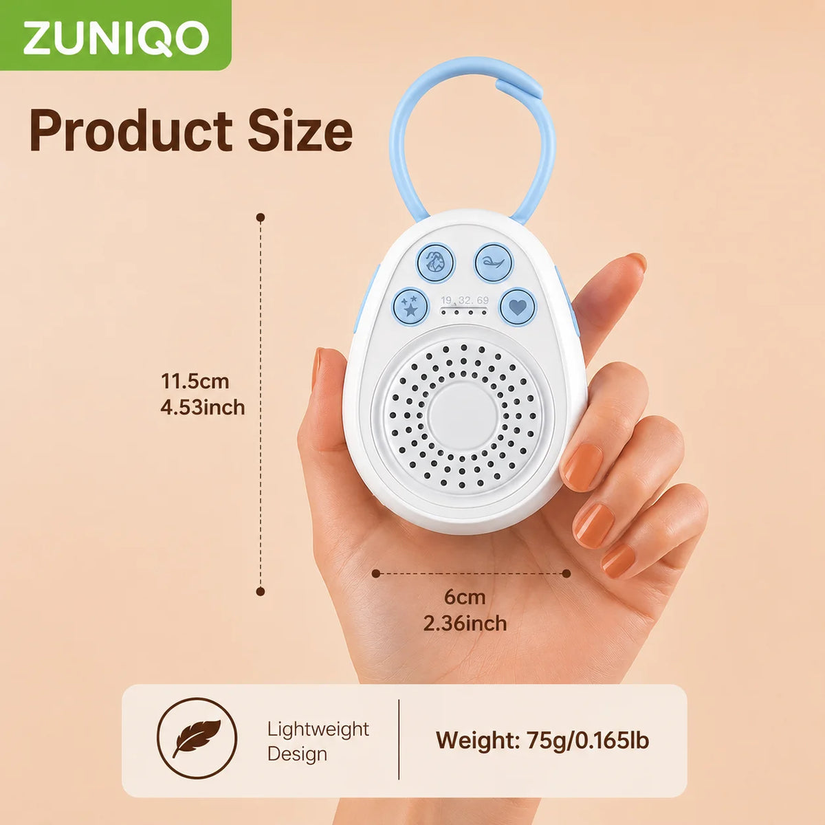 A hand holds a portable white noise machine for baby, which is white and has a light blue strap.