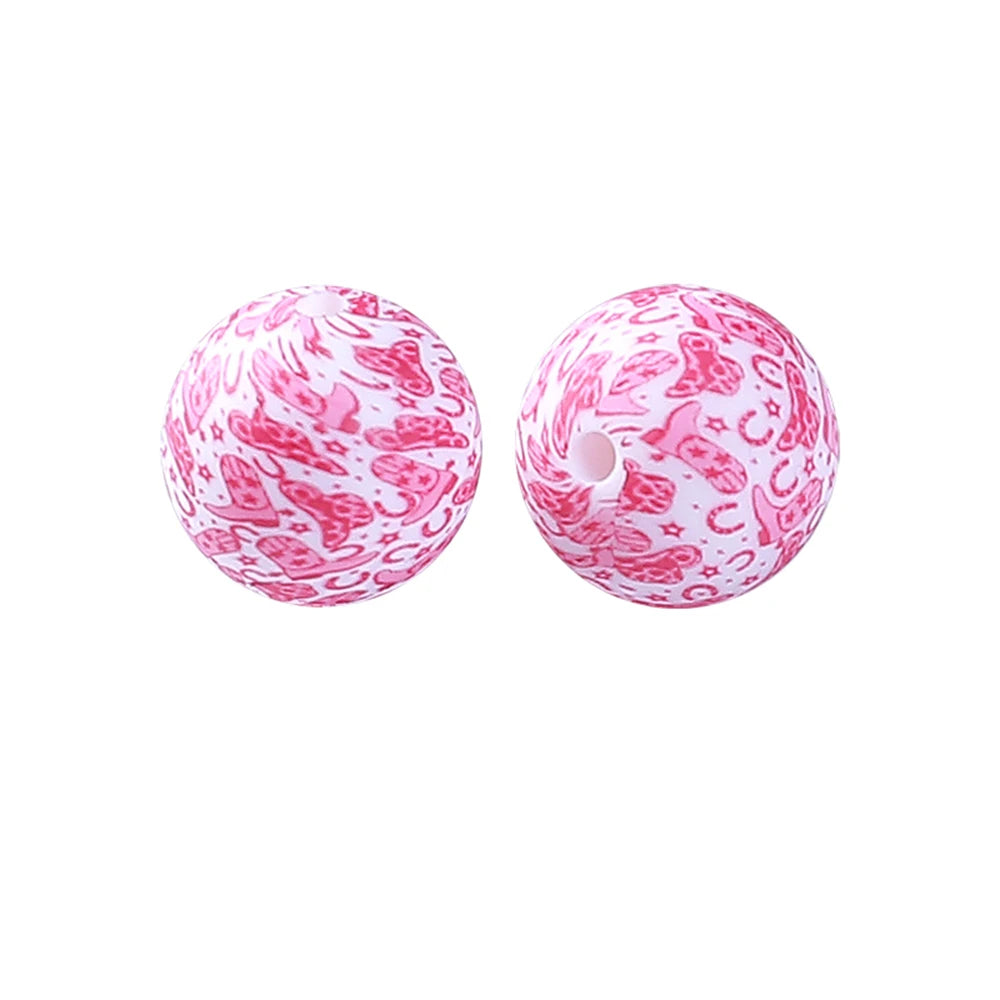 A pair of pink silicone beads with a floral pattern for jewelry making and DIY crafts