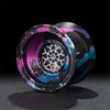 A close-up view of a professional metal yo-yo with a dark purple and blue camouflage pattern.