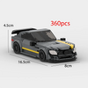 A black and yellow classic supercar model built from LEGO bricks, shown in a side view.