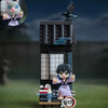 A collectible blind box figure of a purple-haired character and a black bird standing on a dark display box.