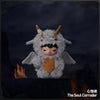 A plush doll pendant of The Soul Corroder featuring a gray, furry creature with horns and orange accents.