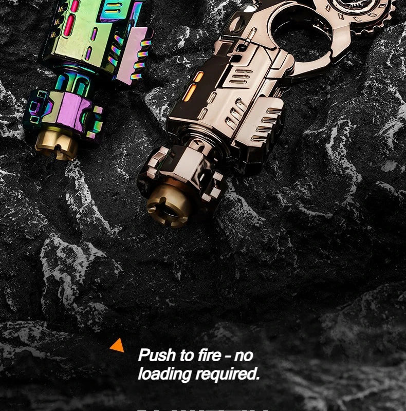 A close-up of a metallic toy pistol and fidget spinner set resting on a dark, textured surface.