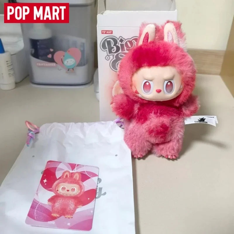 A pink Labubu vinyl plush pendant blind box with large ears and a cute face is displayed on a white background.