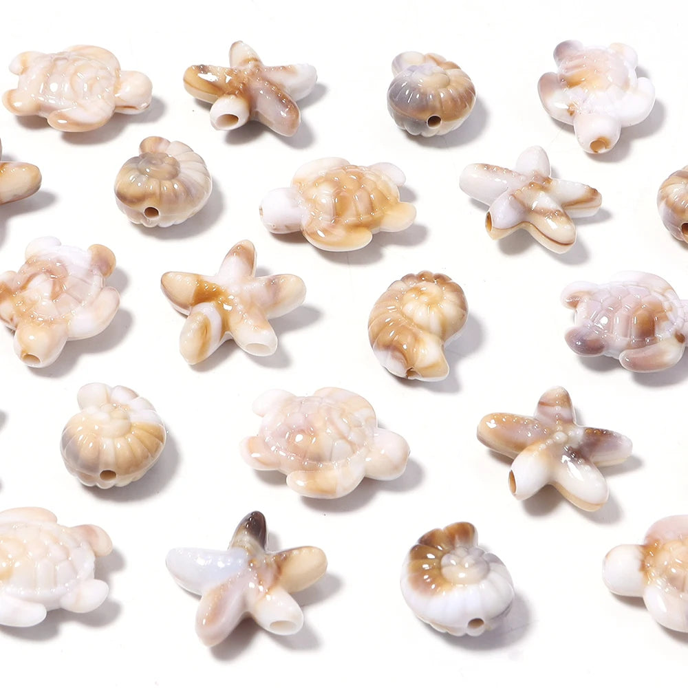 Variety pack of acrylic beads shaped like starfish, conch, and turtle in various natural colors