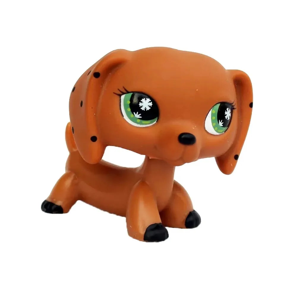 Orangefarbene Sammler-Katzenfigur mit großen grünen Augen und flachen Ohren.