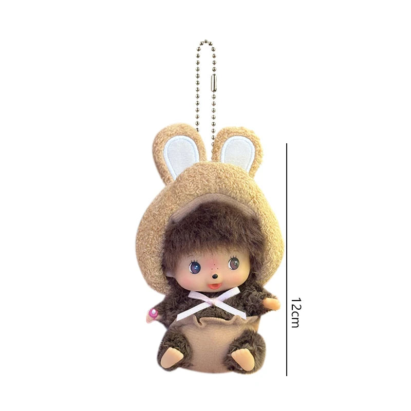A cute brown plush cartoon character with large ears is shown hanging from a chain.