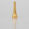 A gold-plated trumpet mouthpiece with a tapered design and an engraved signature.