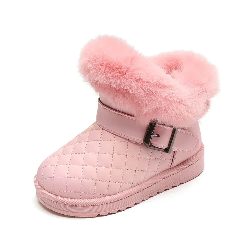Pink girls snow boots with a fluffy pink faux fur lining and a crystal bow detail