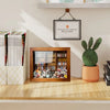 A wooden bookshelf decor featuring a mini fidget shelf and various books displayed on a light wood shelf.