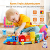 A toddler is playing with a colorful wooden train set featuring farm animals for educational fun.
