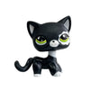 Black and white bobblehead figurine of a dachshund kitten with large eyes