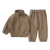 A tan fleece hooded tracksuit set for a child, consisting of a zip-up top and matching pants.