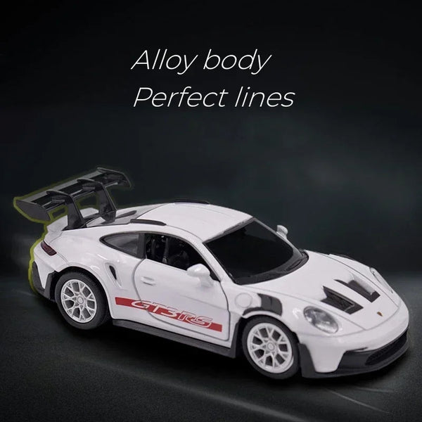White Porsche 911 GT3 RS diecast model car with perfect lines displayed against a dark background.