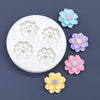 A silicone mold set featuring various colored daisy flowers in light blue, purple, pink, and yellow.