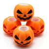 An orange Halloween pumpkin squishy fidget toy with a carved face design.