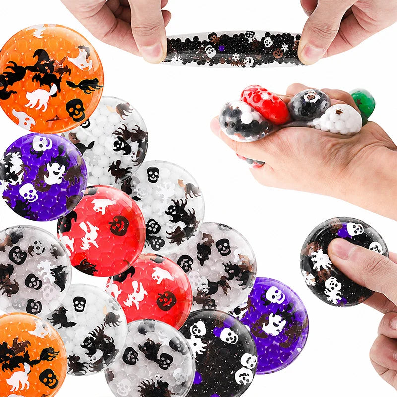 A hand is squeezing a Halloween pumpkin and ghost squishy stress ball, showing the texture and detail of the product.