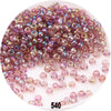 A pile of colorful round loose glass seed beads for jewelry making