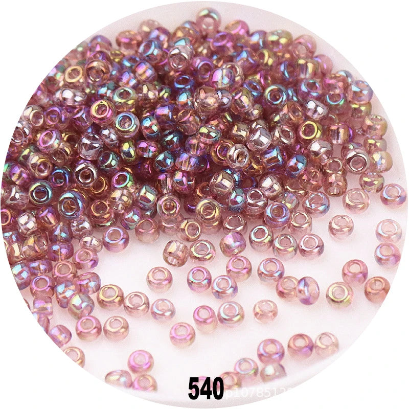 A pile of colorful round loose glass seed beads for jewelry making