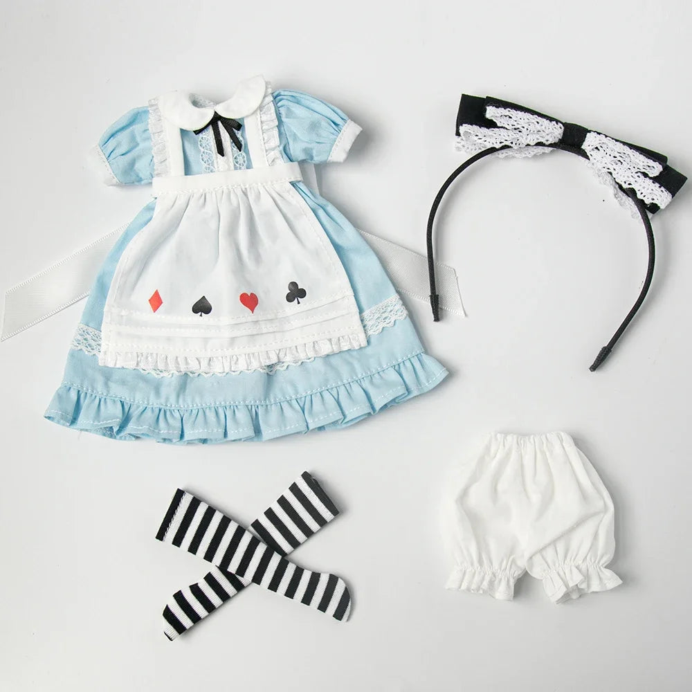 Vintage lace maid dress set for dolls featuring a light blue and white dress, black bow, and a black lace headband.