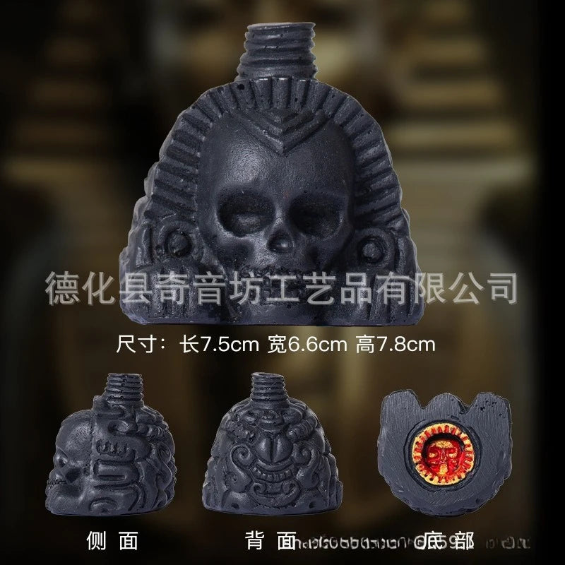 A dark gray Aztec death whistle skull product with dimensions 7.5cm long, 6.6cm wide, and 7.8cm high.