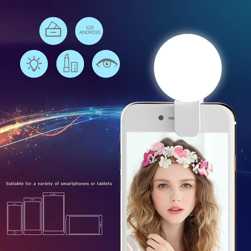 A portable LED selfie ring light is shown illuminating a woman's face on a smartphone screen.