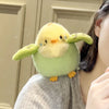 A soft, yellow-green cartoon bird plush with large eyes and orange feet is shown against a light background.