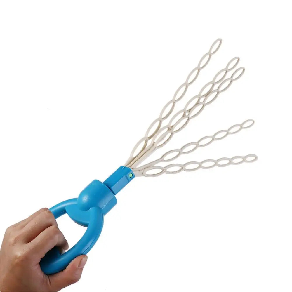 A hand holds a blue bubble wand with multiple white strings for blowing bubbles.