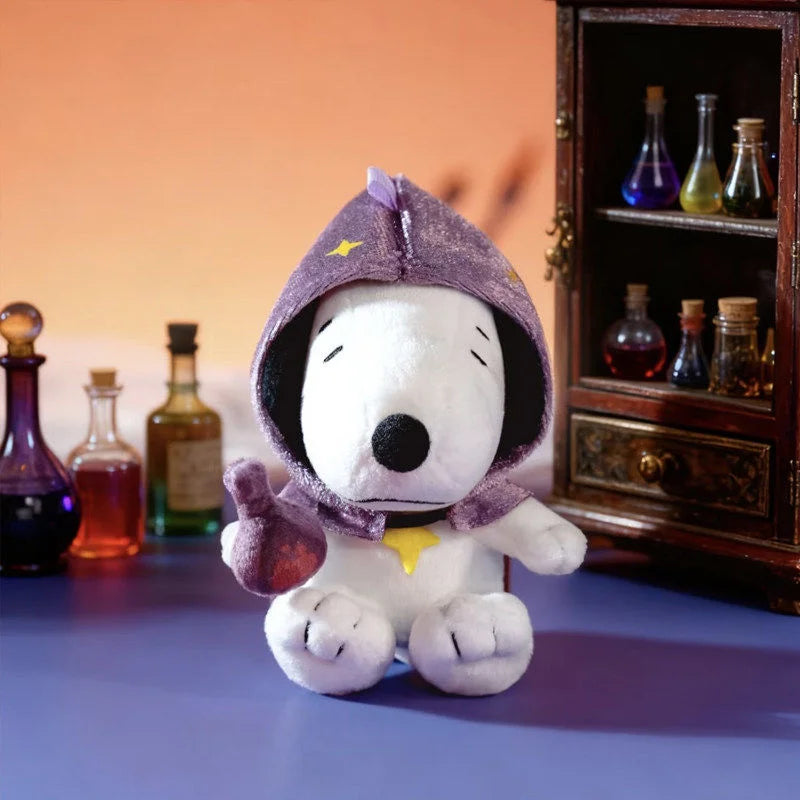 A white Snoopy collectible figure wearing a purple hood and yellow star, sitting in front of a wooden cabinet with glass bott