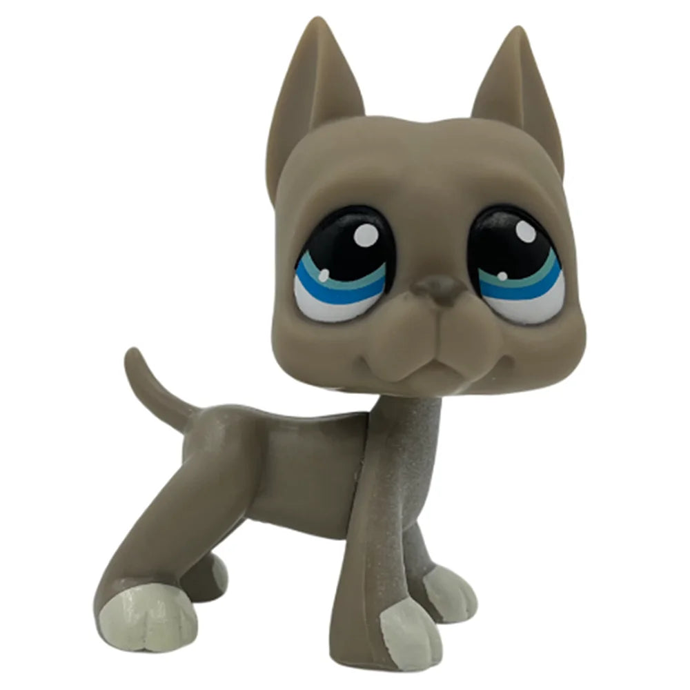A small, gray Bobblehead toy of a cat with blue glowing eyes.