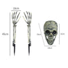 A realistic skull design made from bone or resin, shown next to a spring snake prank can.