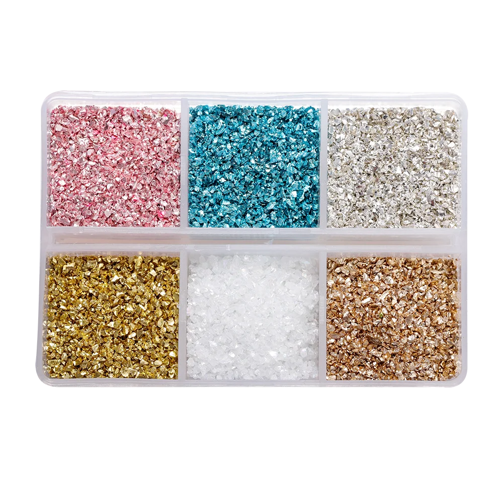 A clear plastic box containing four compartments of colored crushed glass stones for resin and craft projects.