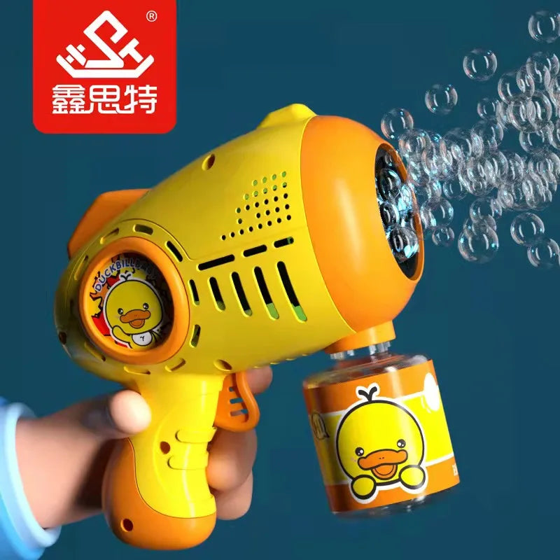 A hand holds a yellow automatic bubble machine with a duck design, creating bubbles against a blue background.
