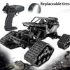 Black 4WD remote control off-road crawler truck with replaceable tires and a remote control.