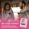 A couple laughing while playing a couples drinking game with wine glasses.