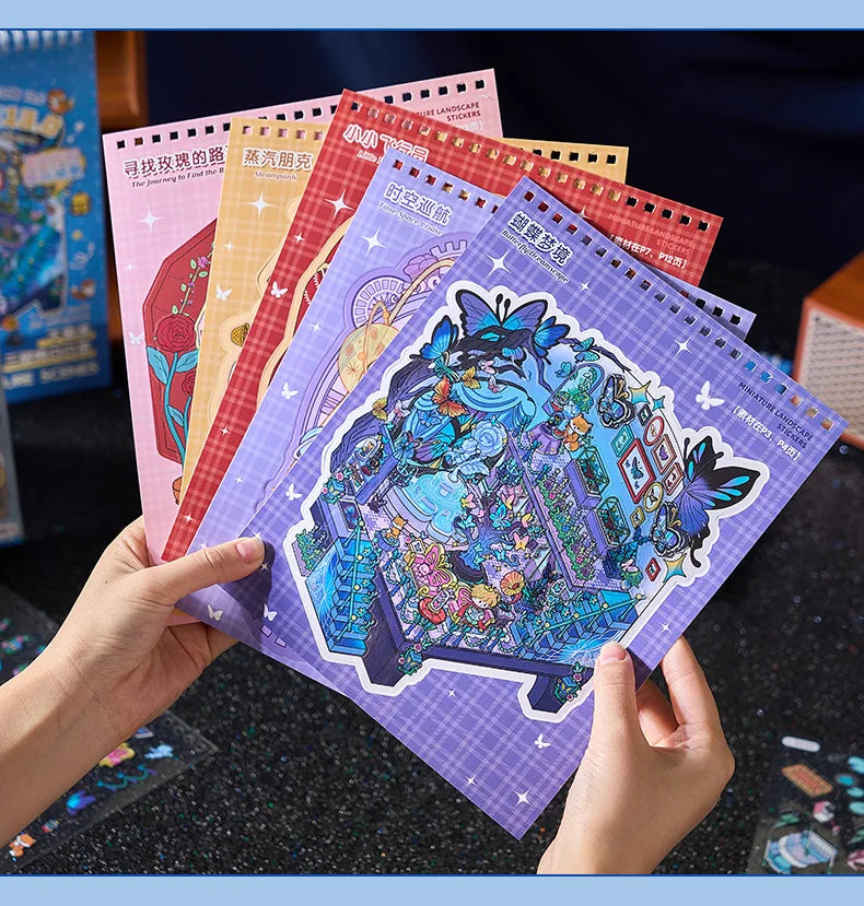 A hand holds a stack of colorful 3D cartoon scene stickers for scrapbooking and journaling.