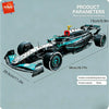 A black and teal 1:8 scale formula racing car building block set with steering and engine linkage.
