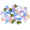 A collection of colorful acrylic cross beads in shades of blue, pink, and green for jewelry making.