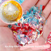 A hand holds a pile of multicolor ice strip acrylic filler for handmade squishy balls and nail art crafts.
