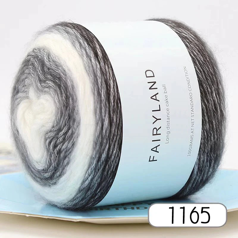 Roll of grey and white gradient yarn labeled Fairyland with a price tag