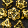 A collection of gold-colored polyhedral dice, including a d10 and d12, set against a dark background.