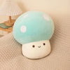 A soft, light blue and white mushroom plush pillow with a smiling face resting on a beige fabric surface.