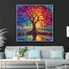 A vibrant diamond painting kit featuring a scenic tree landscape with colorful foliage and a detailed trunk.