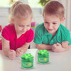 Two children are looking at a jar of green slime putty for kids