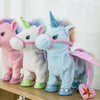 A plush toy of a musical walking unicorn in light blue with pink accents standing on a wooden surface.