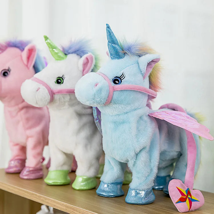A plush toy of a musical walking unicorn in light blue with pink accents standing on a wooden surface.